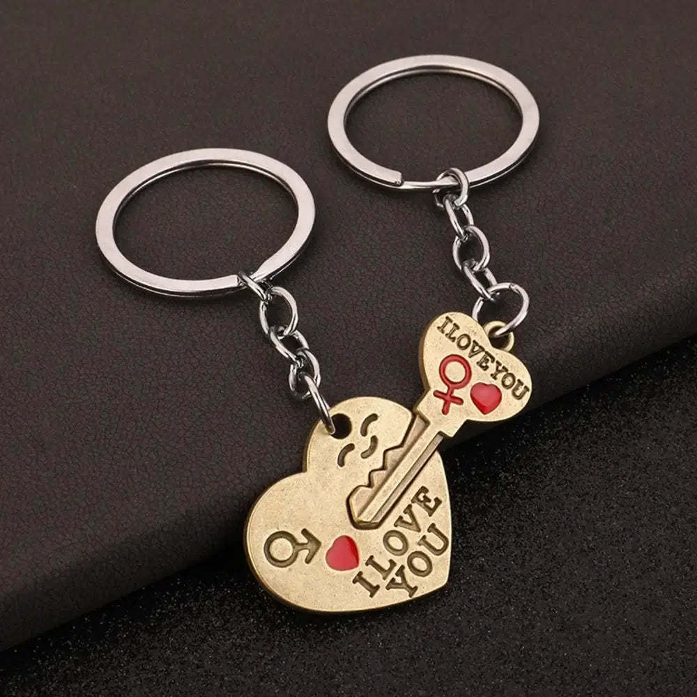 Pair of heart-shaped keychain with 'I Love You' text on a dark background