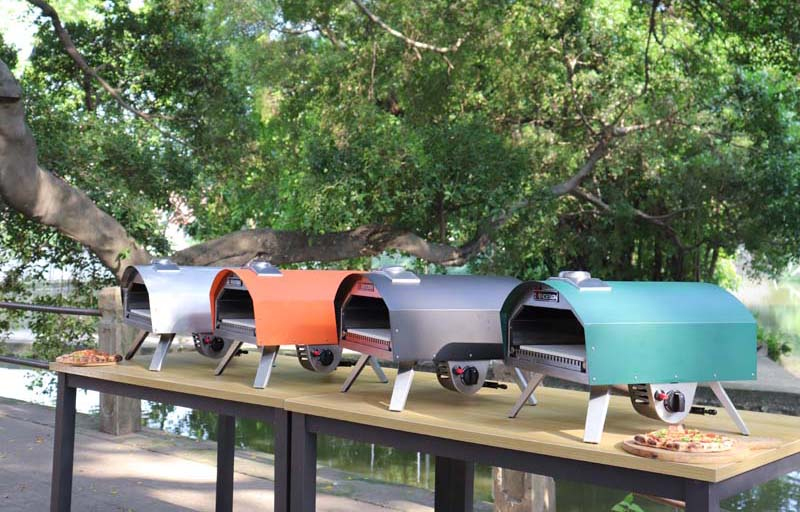 12 Inch Collapsible Gas Pizza Oven With U-shaped Fire Row Burning of orange-red, black, steel, and blue-green colors for Indoor or Outdoor Picnics