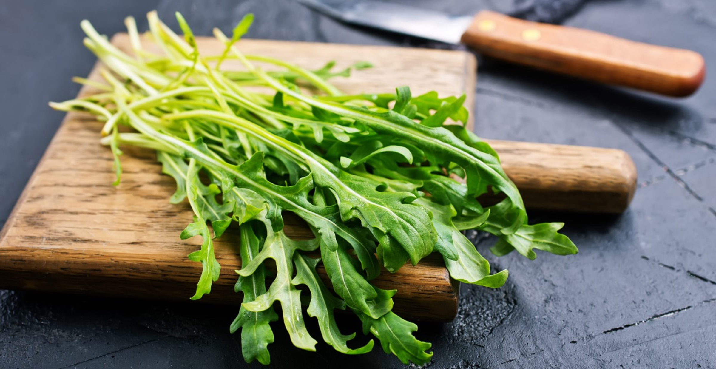 Chopping Hydroponic Arugula on a Cutting Board