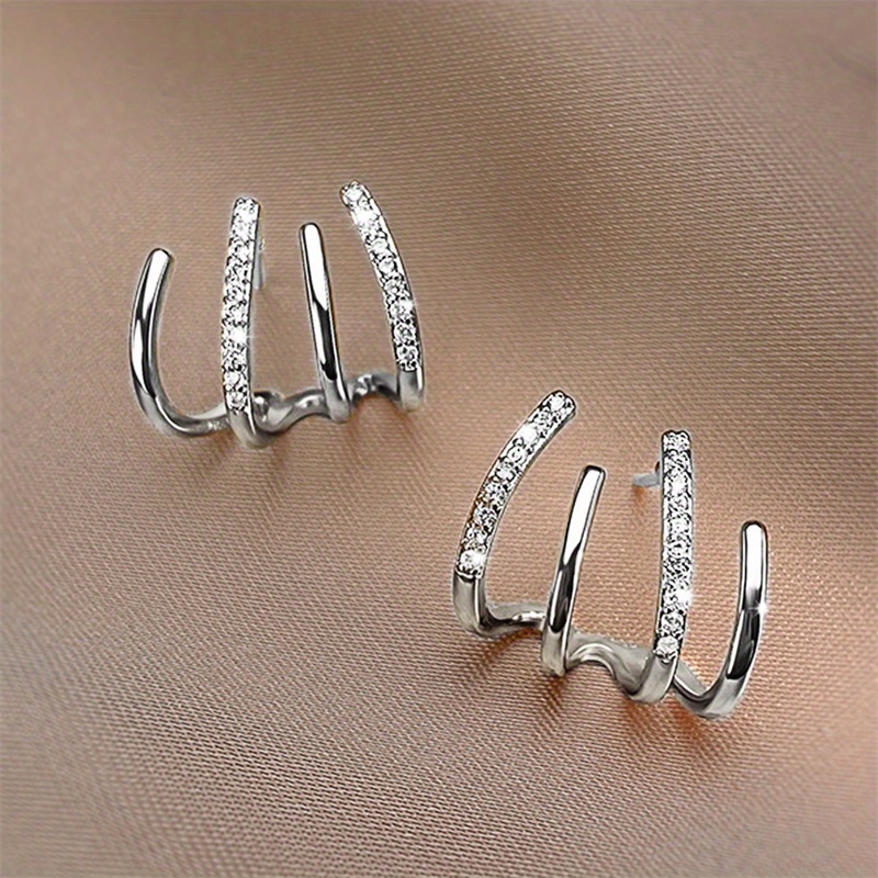 🎁 50% sleva na všechny produkty !Třpytivé, elegantní a sexy napichovací náušnice s designem ve tvaru drápů
