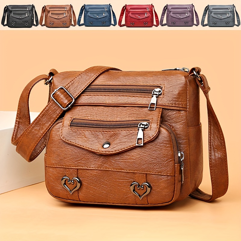 🎀Retro crossbody kabelka s více kapsami, taška přes rameno z měkké PU kůže, dámská kabelka s kovovým srdcem 💼