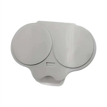 A light gray plastic replacement cover or cap with two circular domed sections and a small rectangular slot, shown on a plain white background.