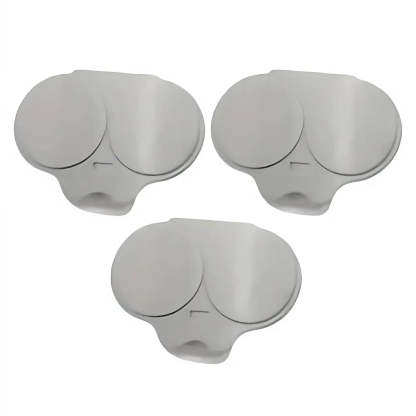 Three light gray silicone replacement earplugs arranged on a plain white background.