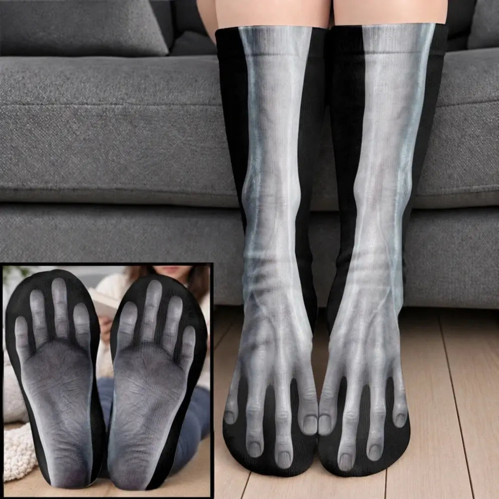 Gray bony human foot socks with visible toe bones worn on legs before a gray sofa