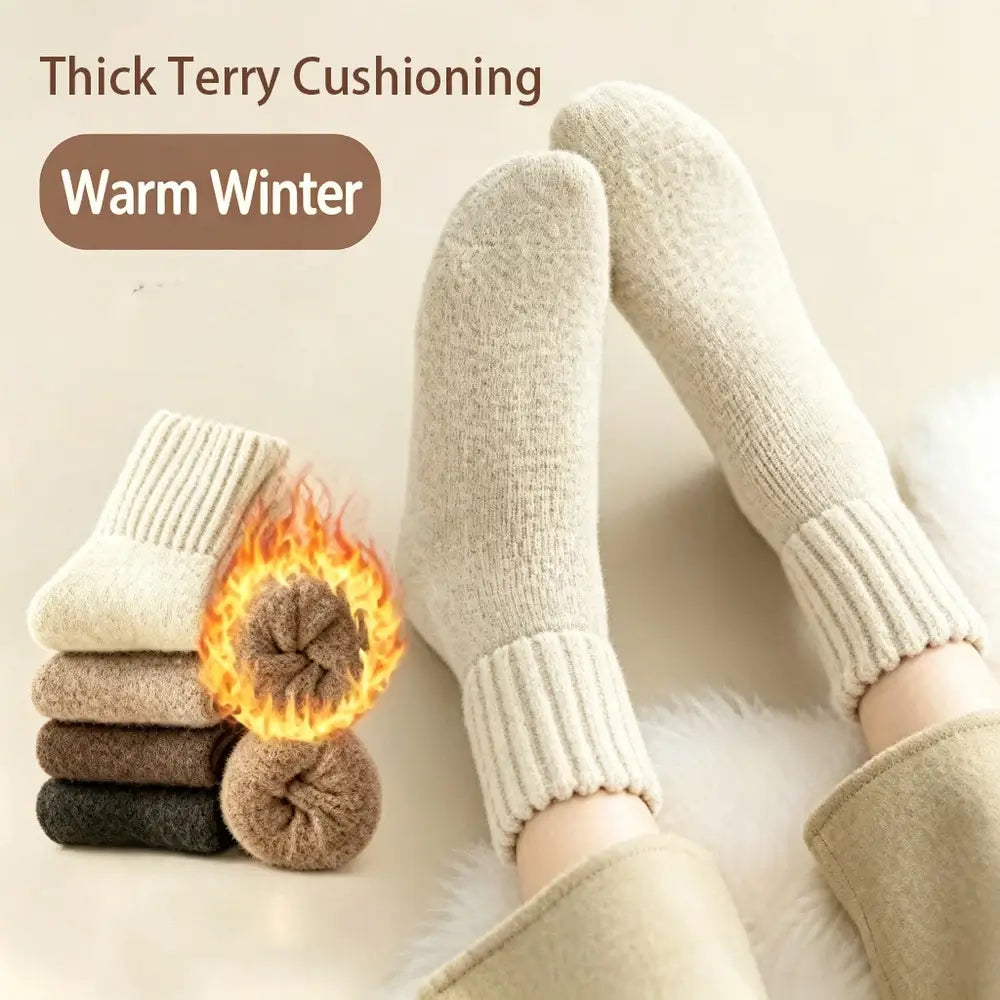A pair of cream-colored knit socks worn on feet, shown with folded versions and a flame graphic highlighting thick Terry lining. The image includes the text 'Thick Terry Cushioning' and 'Warm Winter'.