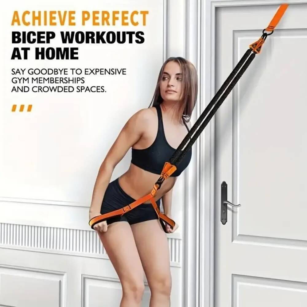 Bicep workout at home with the orange resistance band set on a door anchor