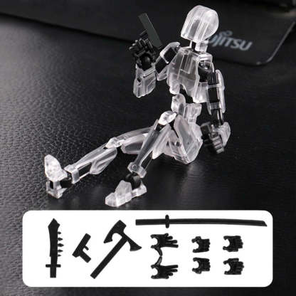 A transparent acrylic action figure of a kneeling robot or mecha on a black textured surface, with interchangeable black weapon and limb accessories shown in a white box at the bottom.