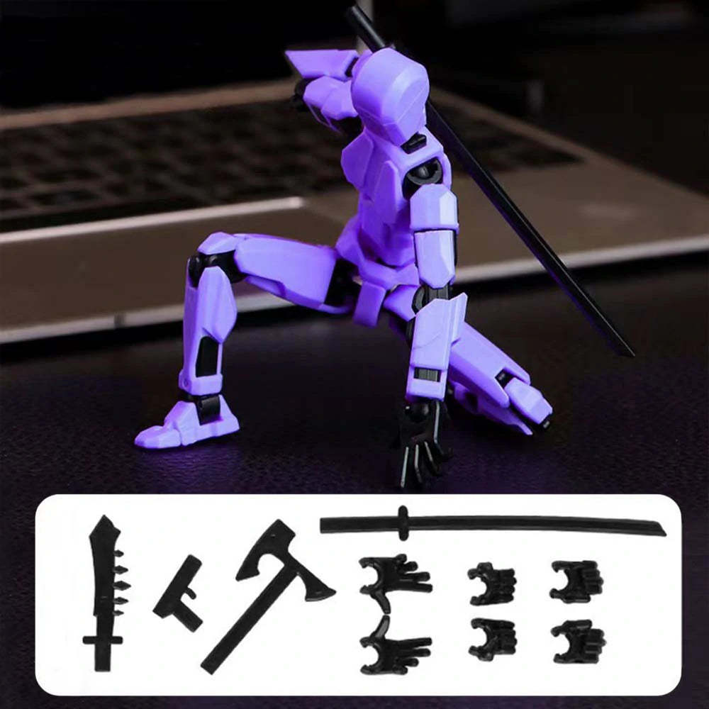 A purple and black articulated mecha action figure posed with a sword on a dark surface, with a laptop blurred in the background and a white panel showing included accessories at the bottom.