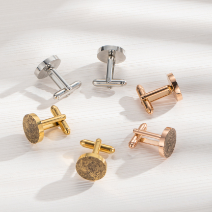 Cufflinks engraved with fingerprints of special significance.