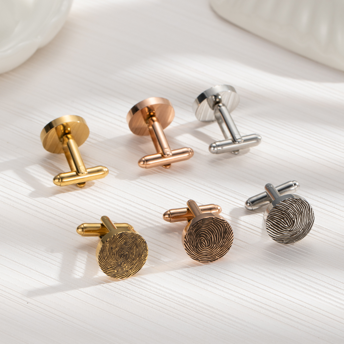 Cufflinks engraved with fingerprints of special significance.