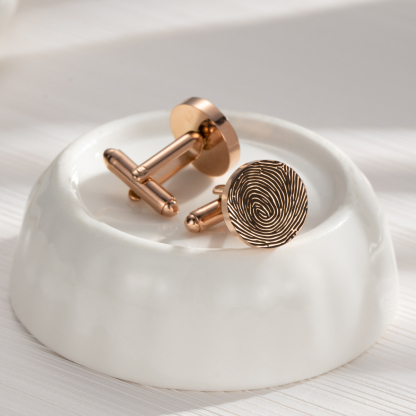 Cufflinks engraved with fingerprints of special significance.