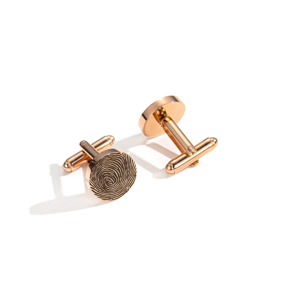 Cufflinks engraved with fingerprints of special significance.