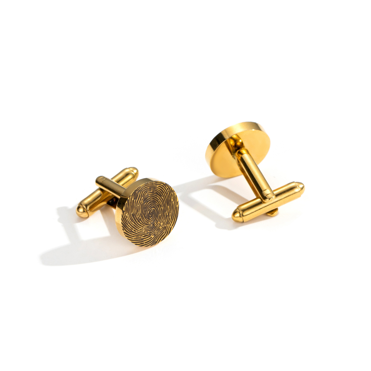Cufflinks engraved with fingerprints of special significance.