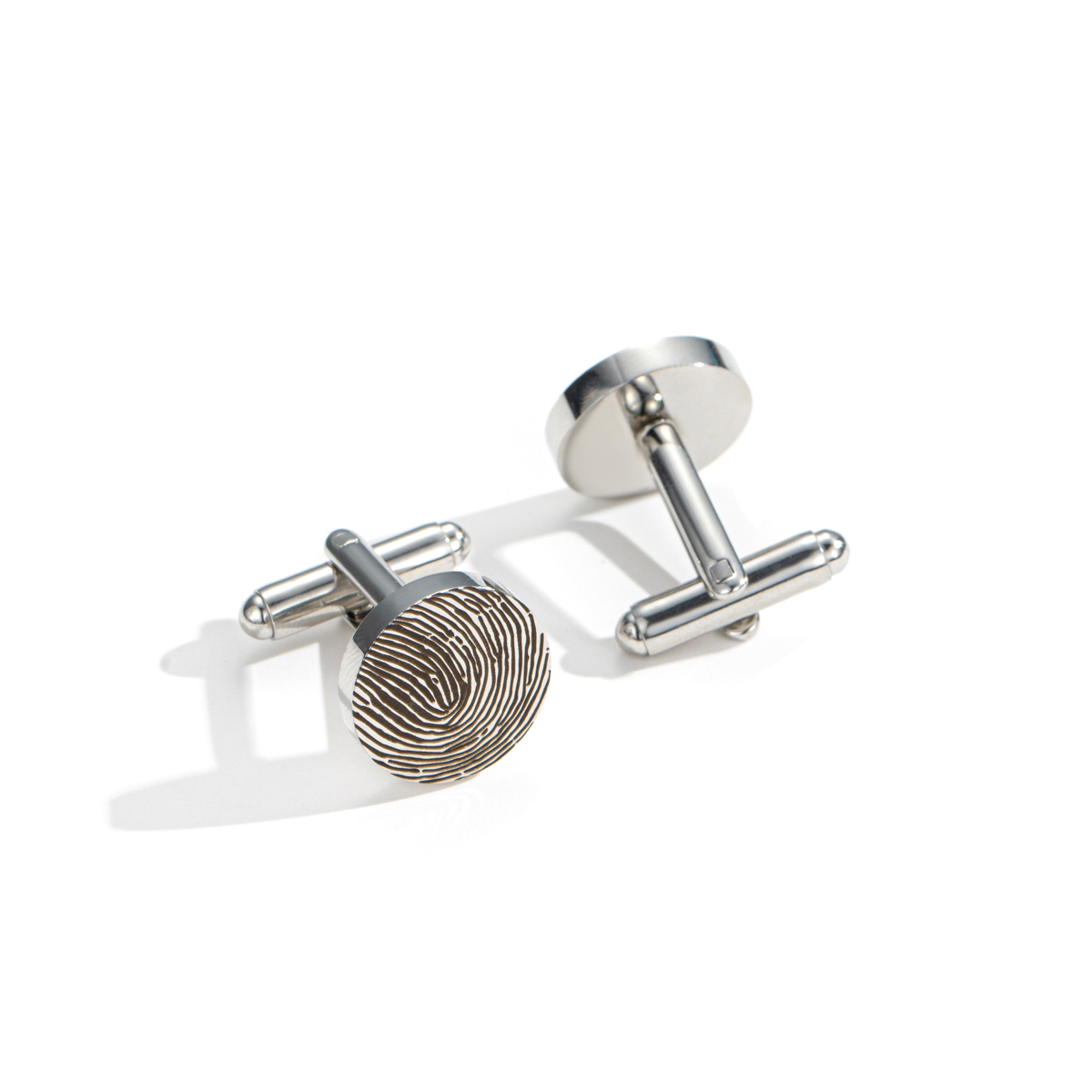 Cufflinks engraved with fingerprints of special significance.