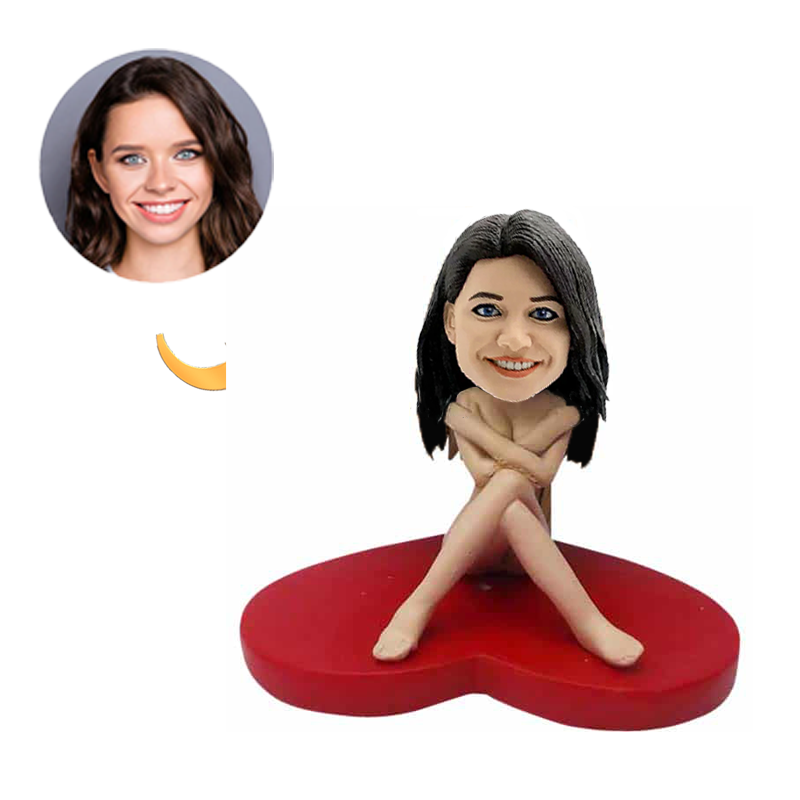 Bobblehead of a Sexy Woman Ssitting on a Red Love Heart