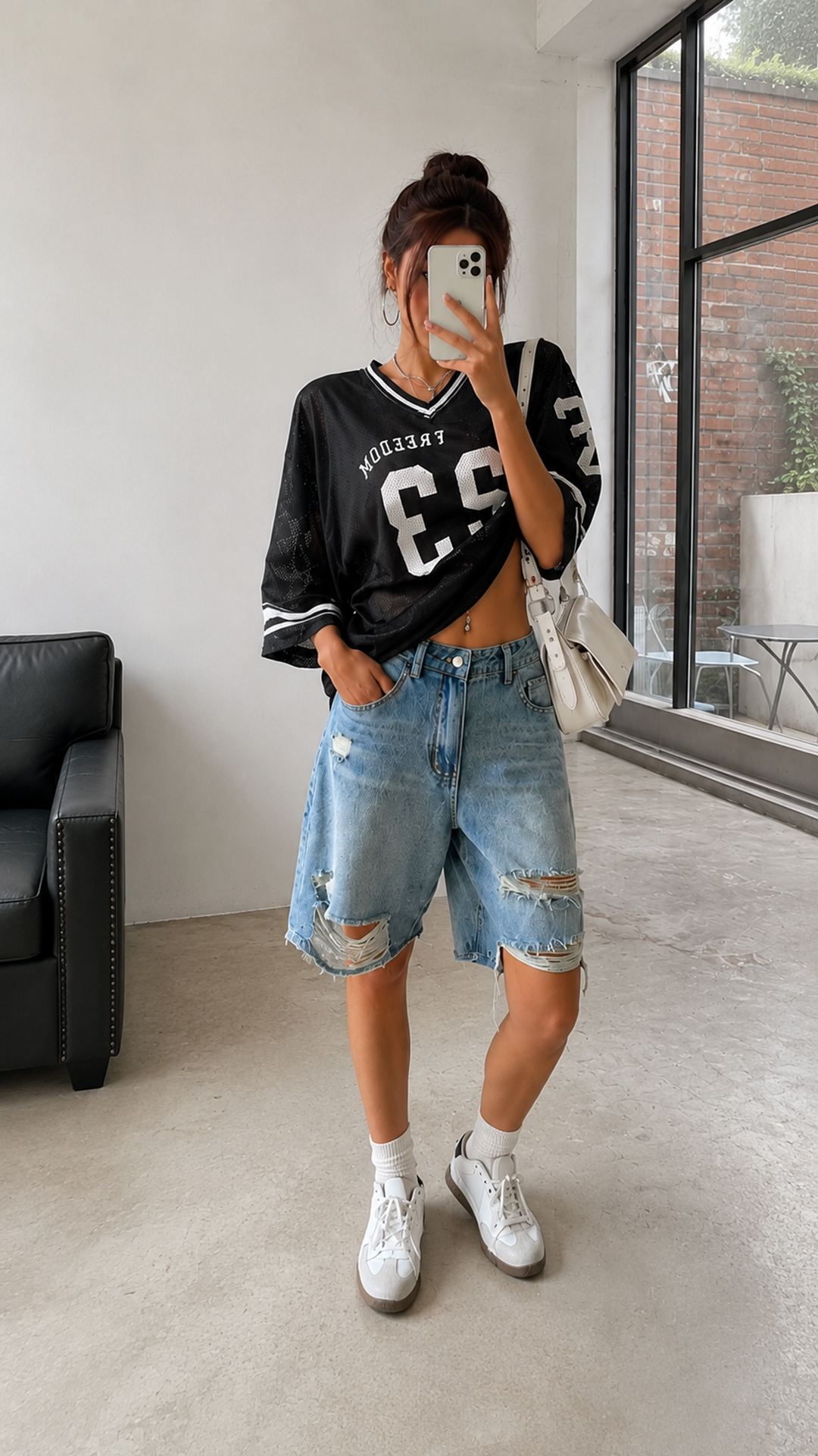 Vintage light wash denim bermuda shorts with ripped details. Straight-leg relaxed fit, ideal for casual streetwear and everyday Y2K styling