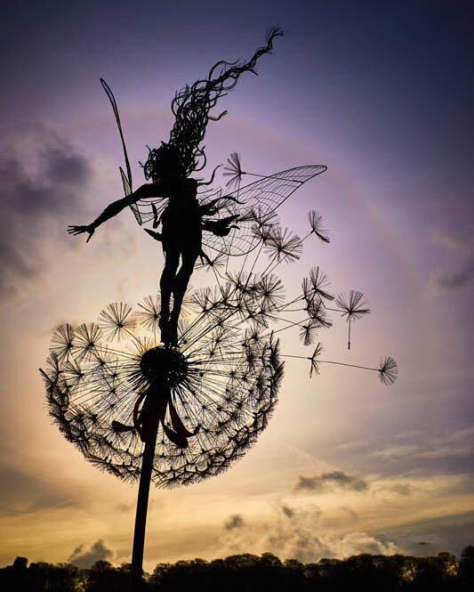 Premium Fairies And Dandelions Dance Together