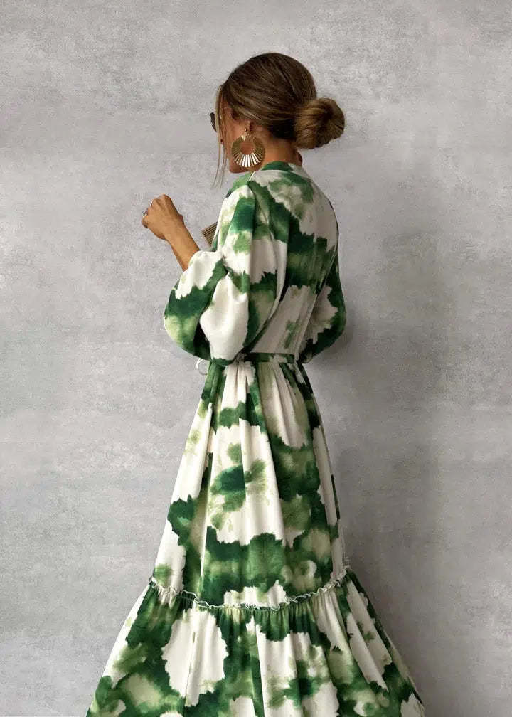 Elegant green maxi dress with v-neckline and long sleeves