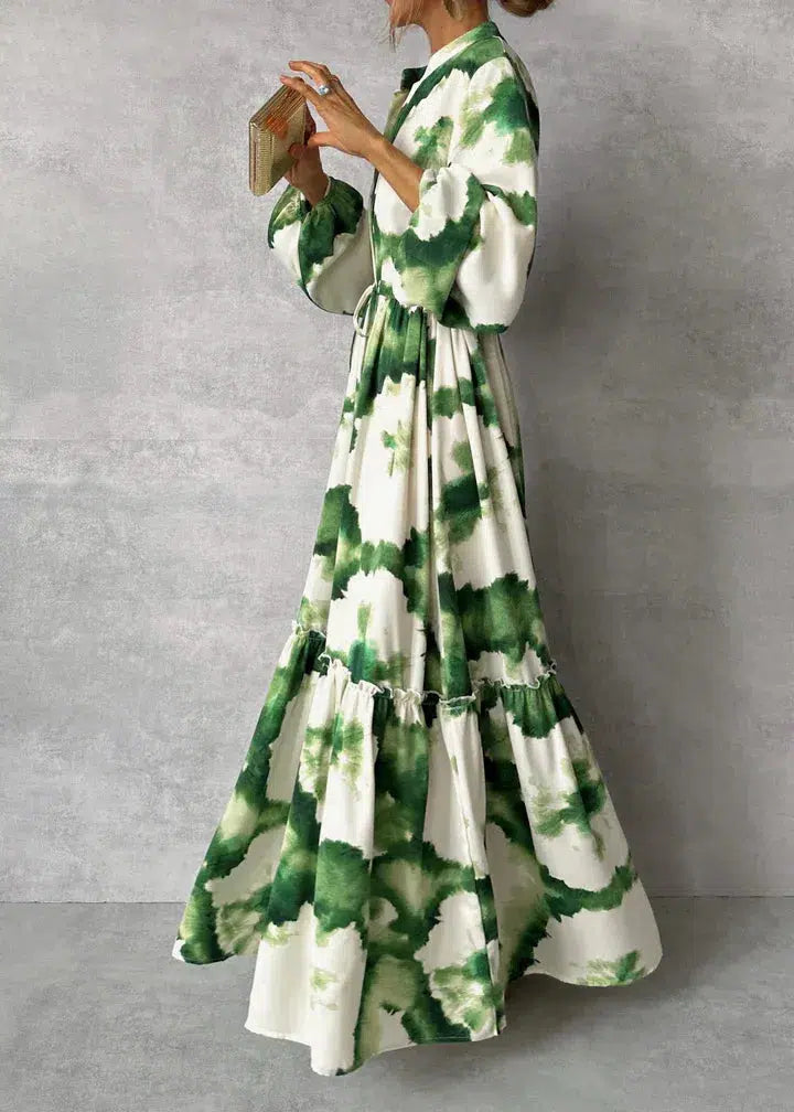 Elegant green maxi dress with v-neckline and long sleeves