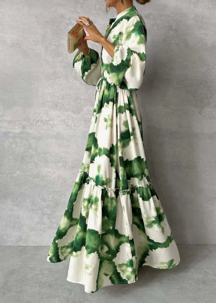 Elegant green maxi dress with v-neckline and long sleeves