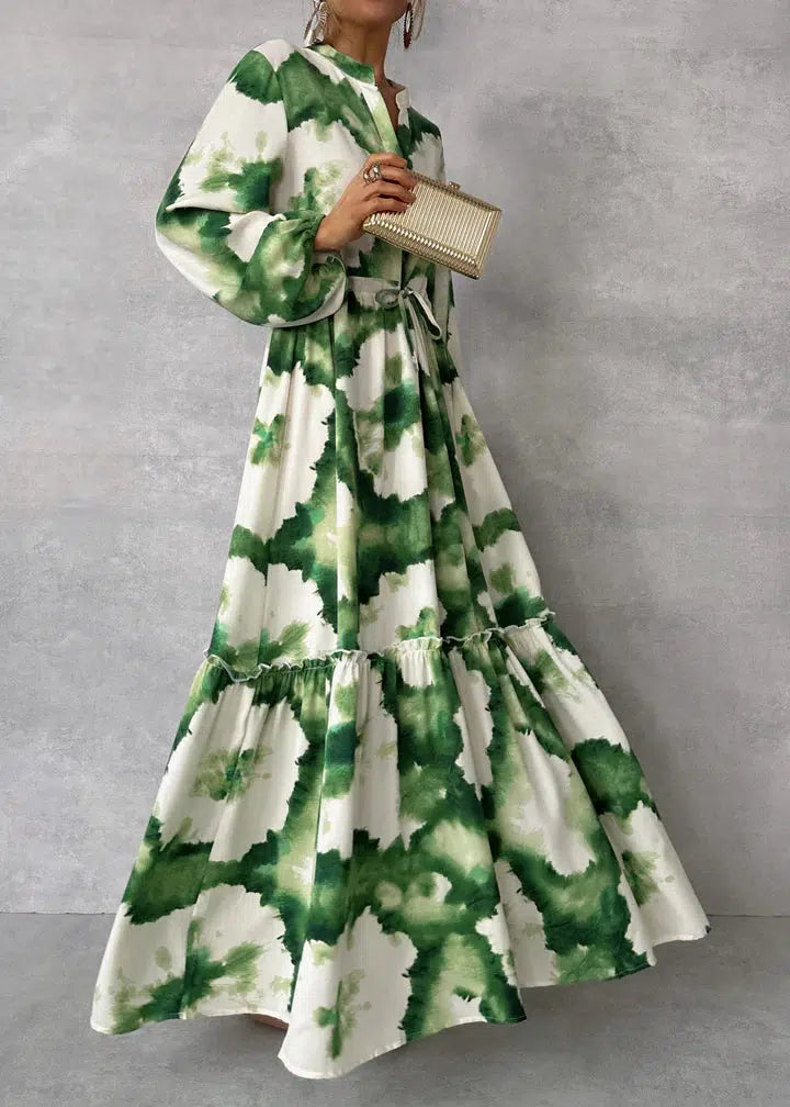 Elegant green maxi dress with v-neckline and long sleeves