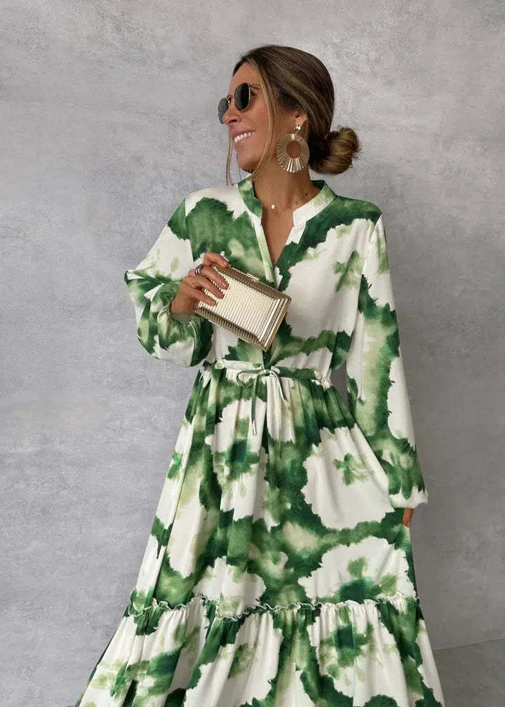 Elegant green maxi dress with v-neckline and long sleeves