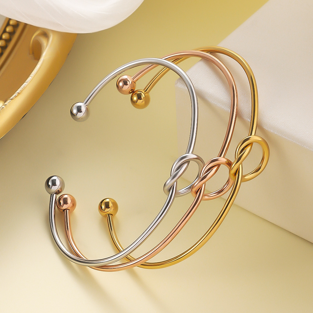 Layered Knot Cuff Bracelets: A Symphony of Shimmer