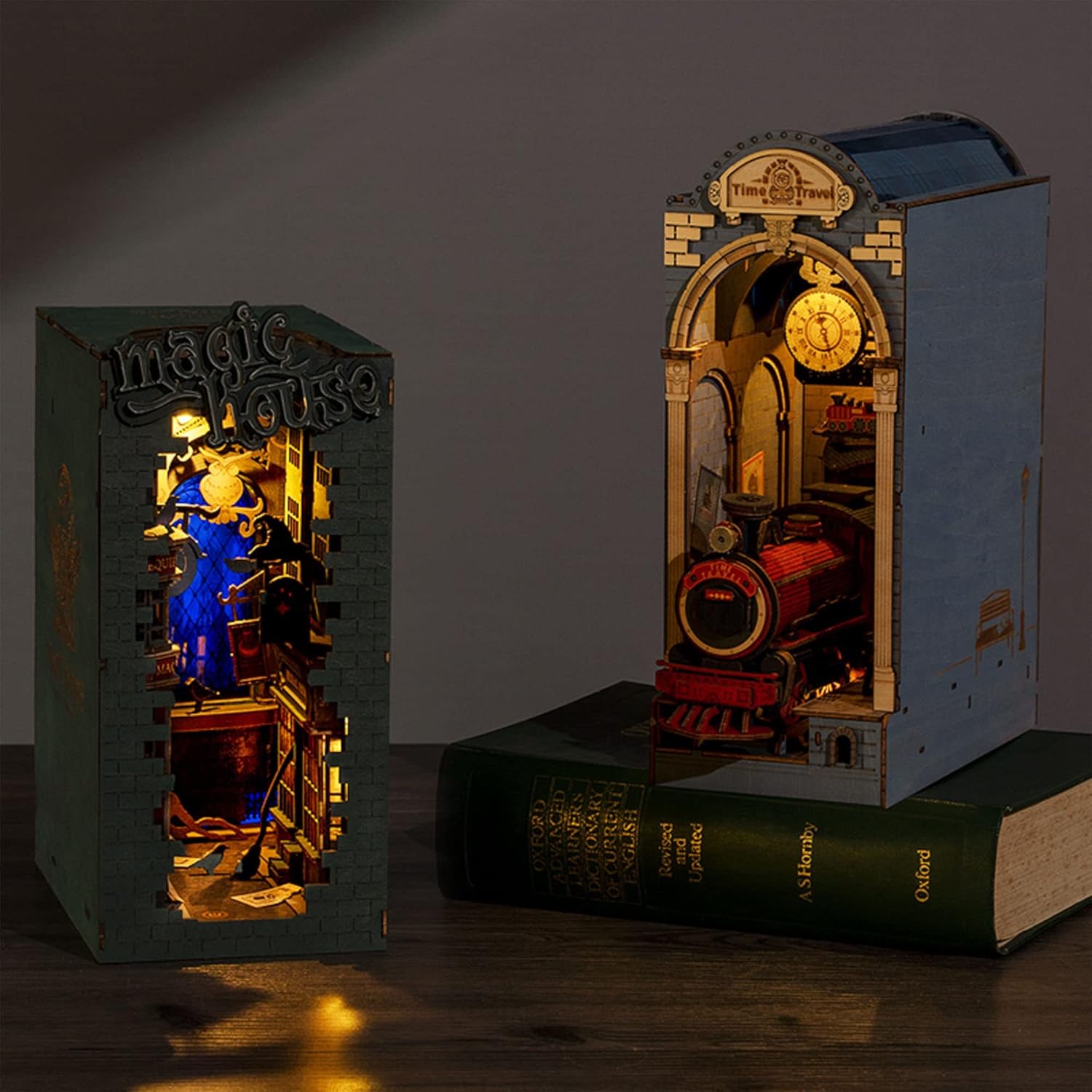 Comparison of Magic House and Time Travel DIY Book Nook kits side by side with LED lights on.-uFunSpace