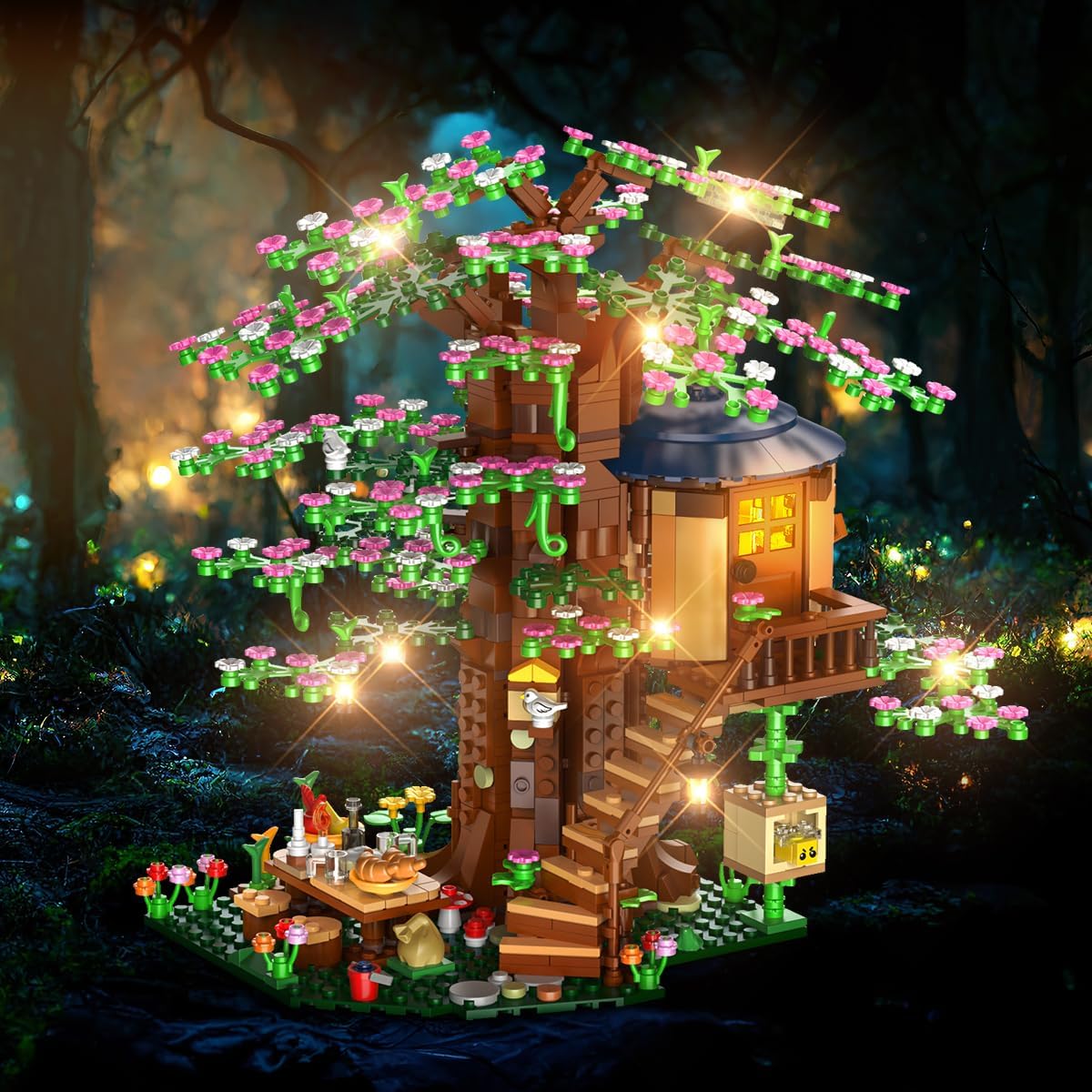 Illuminated tree house building kit with warm LED lights glowing through the branches and cabin windows.