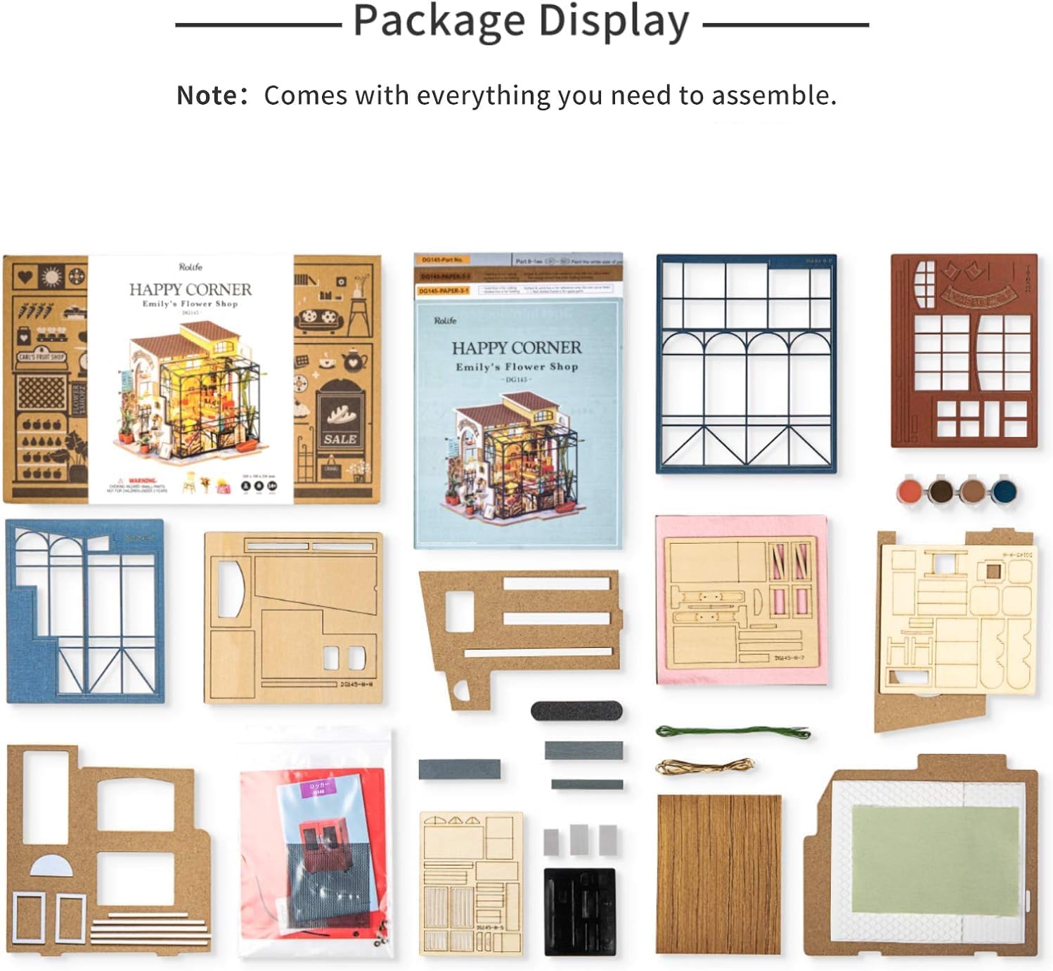 Package contents display showing laser-cut wooden sheets, tools, and accessories for the flower shop kit.