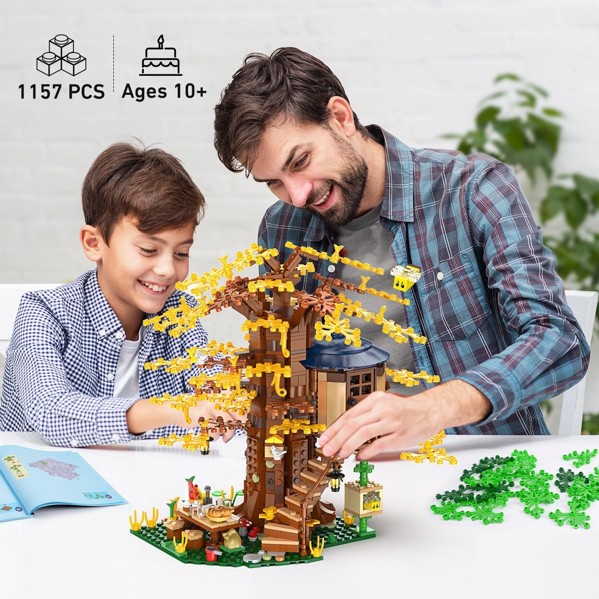 Father and son assembling the 1157-piece tree house model together, educational STEM toy for ages 10+.
