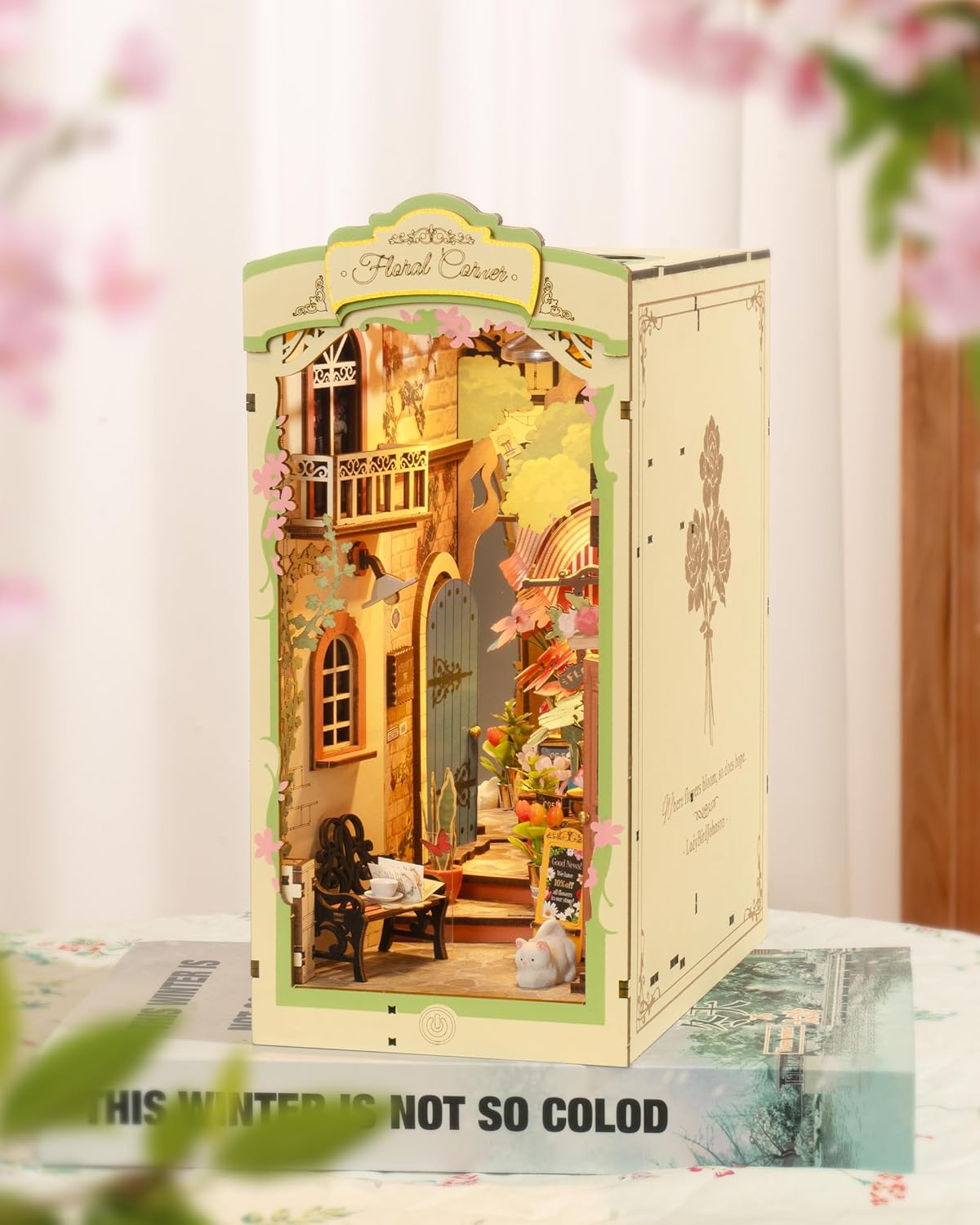 Close up details of miniature flower shop book nook with tiny bench and tulips-uFunSpace