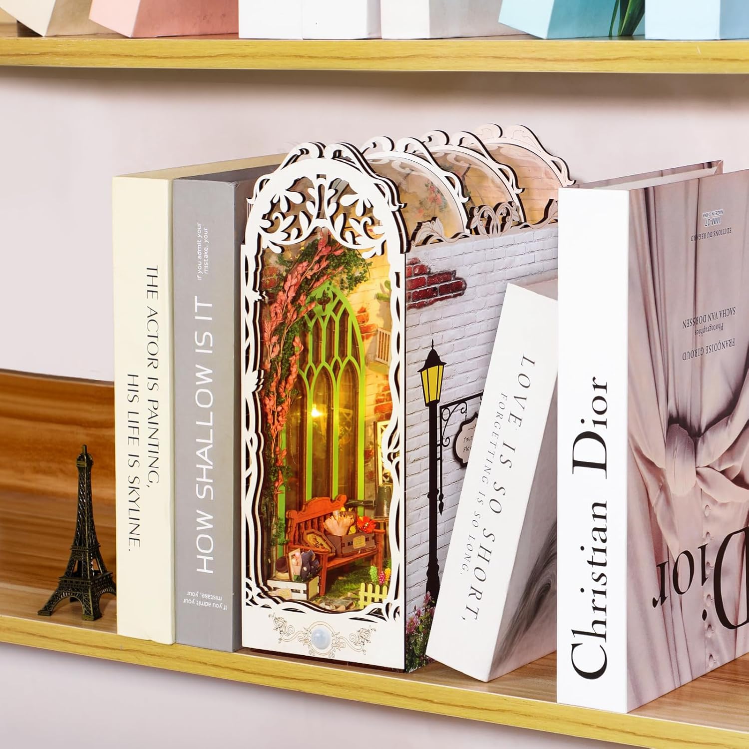 Garden House DIY bookshelf insert placed between books, adding a romantic floral touch to home decor.-uFunSpace