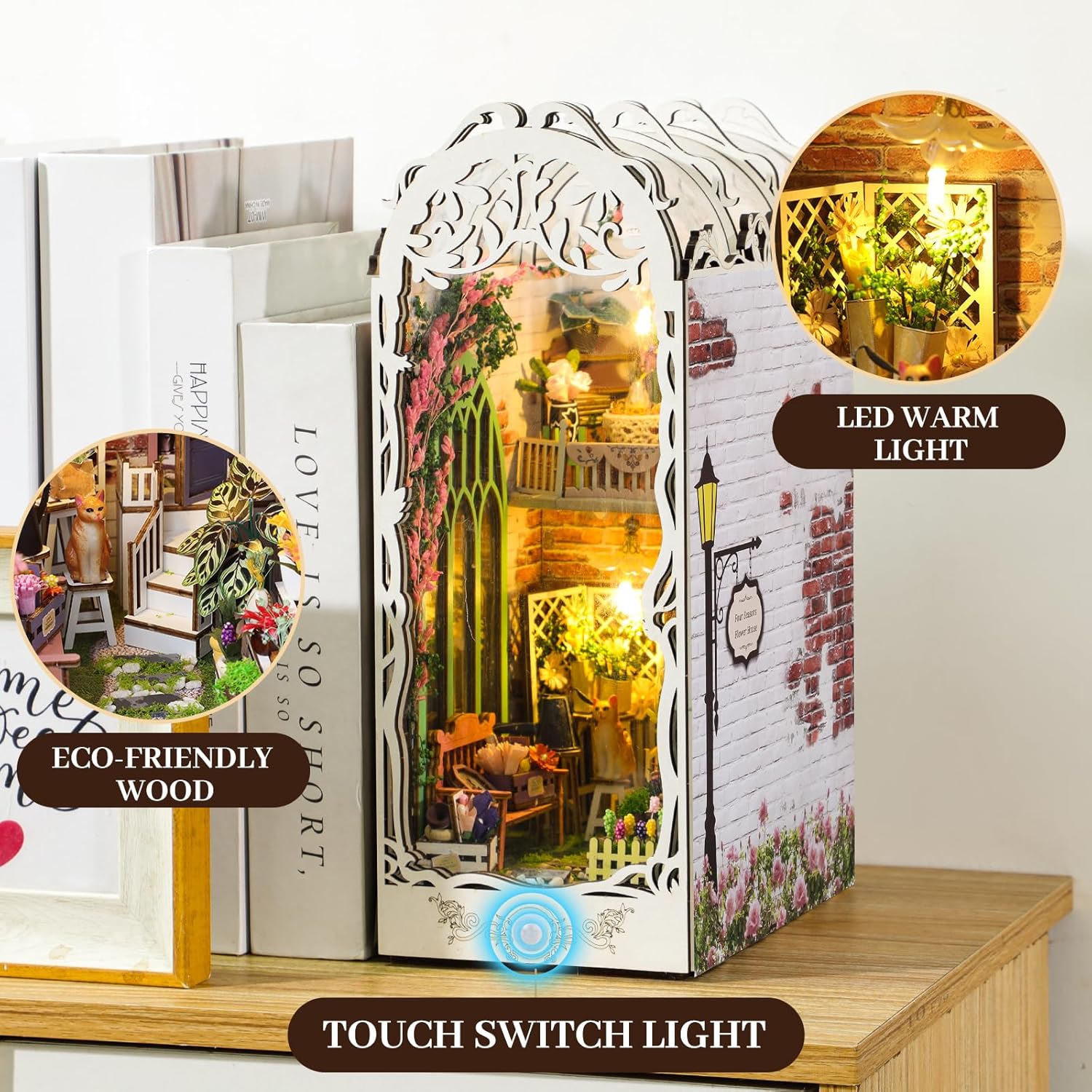 Finished Garden House book nook displayed on a wooden shelf, showing the touch switch and warm LED lighting.-uFunSpace