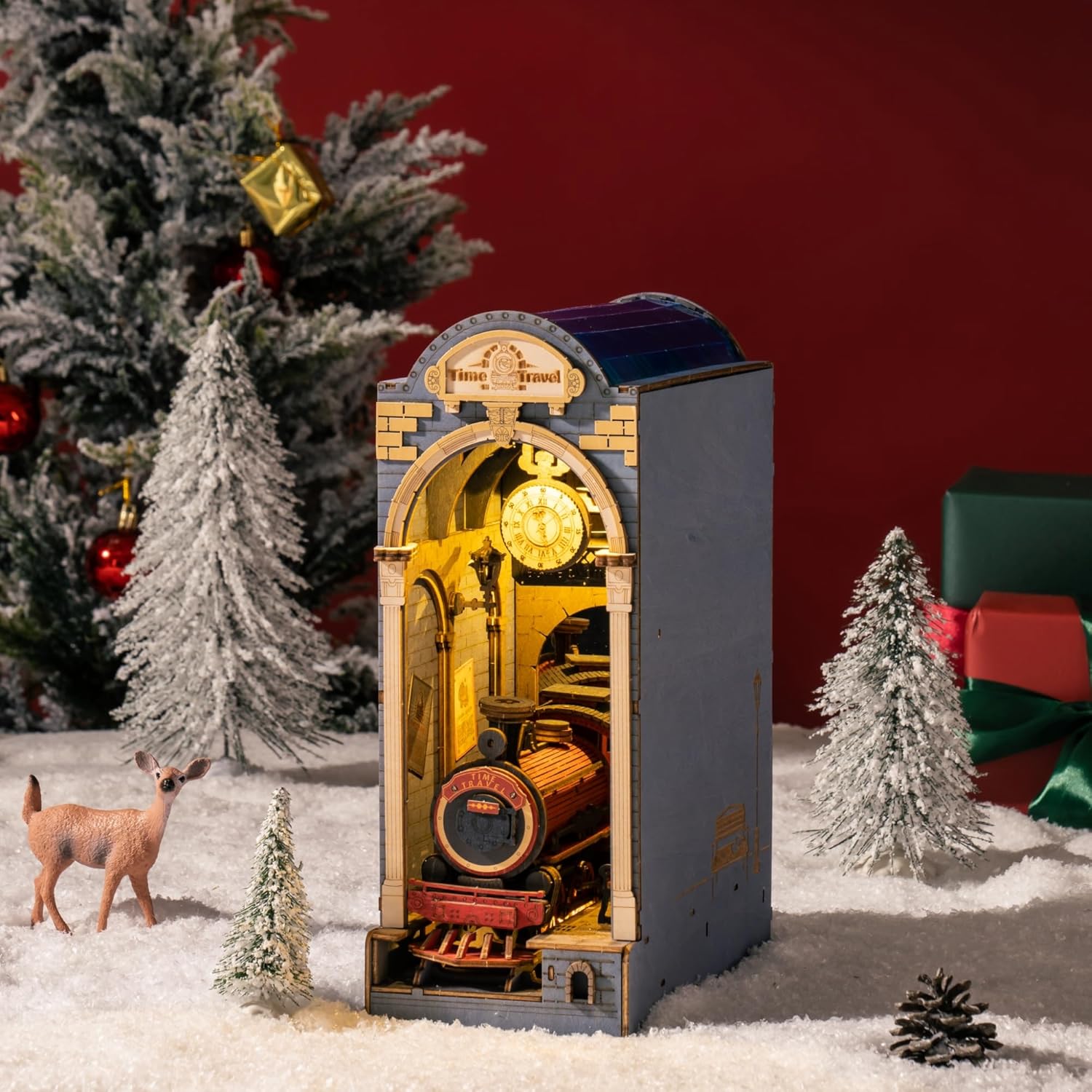 Time Travel DIY Book Nook displayed as a unique Christmas gift, surrounded by snow, pine trees, and holiday decorations.-uFunSpace