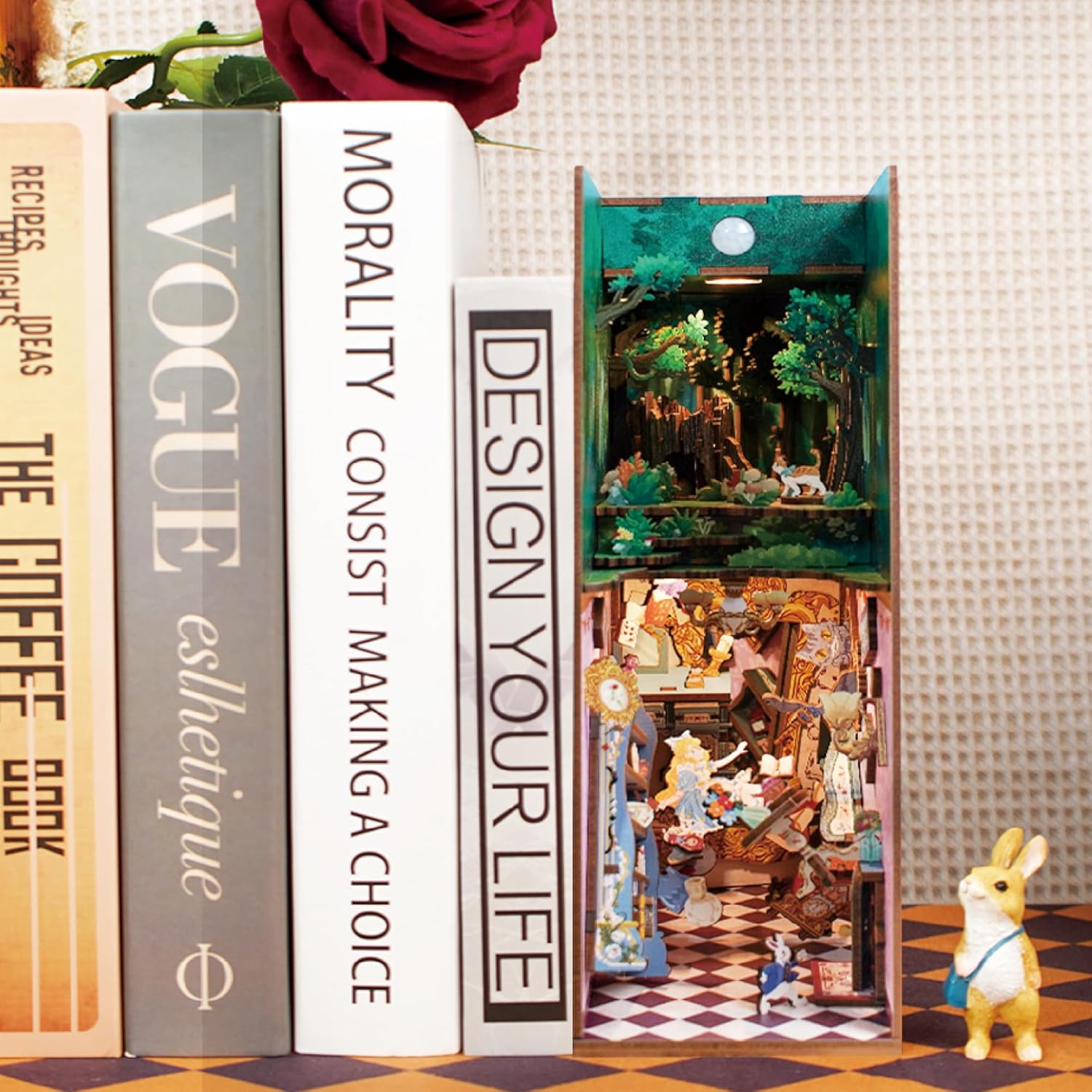 Tonecheer Alice in Wonderland DIY book nook kit displayed on a bookshelf as a decorative insert.