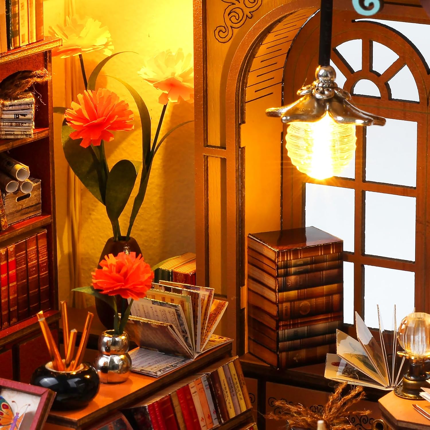 Close-up detail of a vintage hanging LED lamp illuminating handmade paper flowers and wooden bookshelves in the miniature book nook-uFunSpace