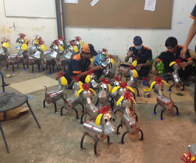 Recycled Garden Ornaments being painted