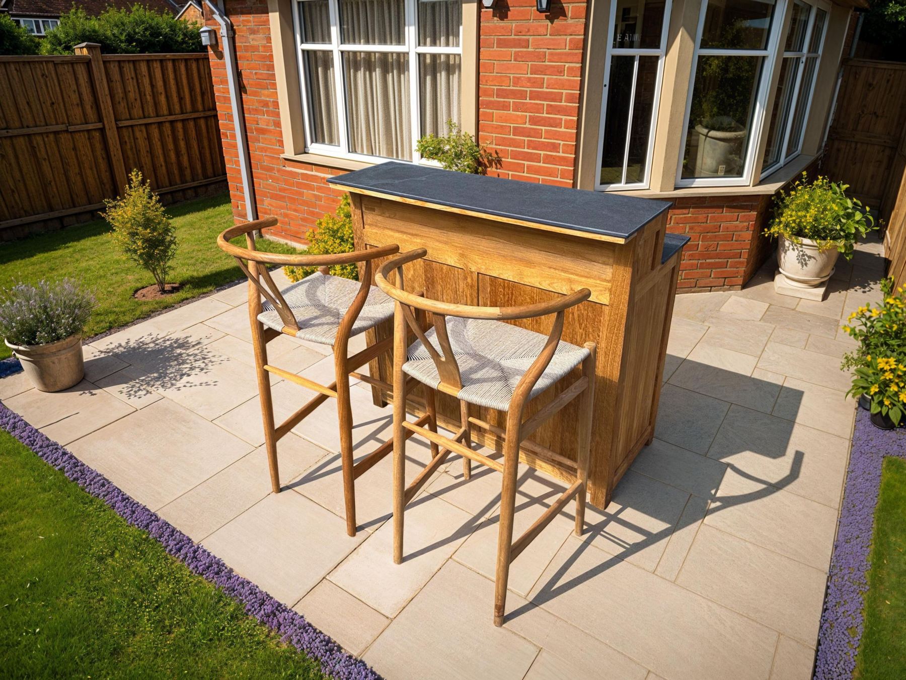 Bari teak outdoor coffee bar kitchen unit with ceramic worktop and bar stools on garden patio