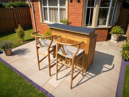 Bari teak outdoor coffee bar kitchen unit with ceramic worktop and bar stools on garden patio