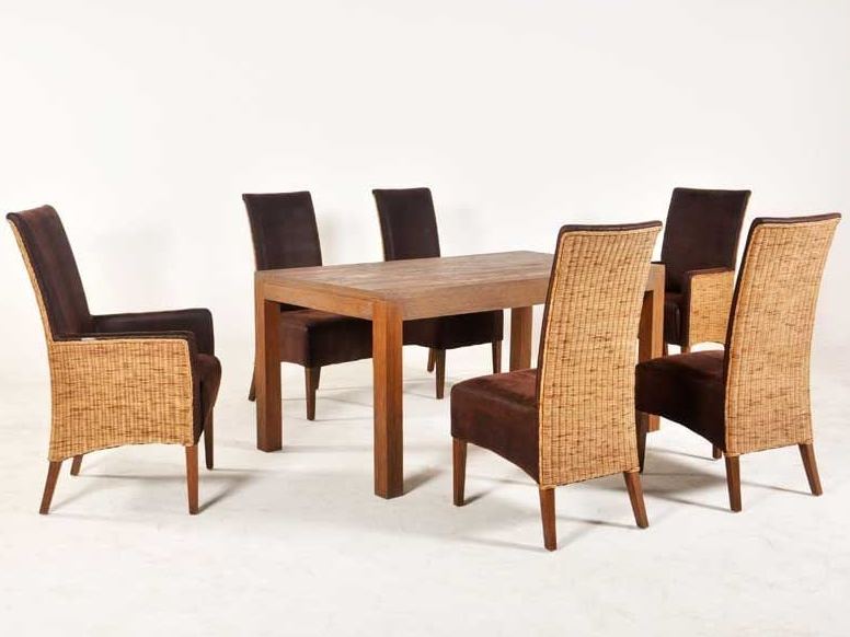 Savana mahogany dining table with six brown leather and woven rattan dining chairs