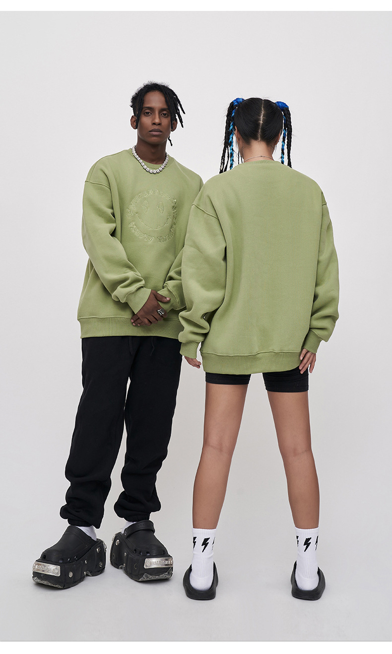 Embroidered smiley face sweatshirt