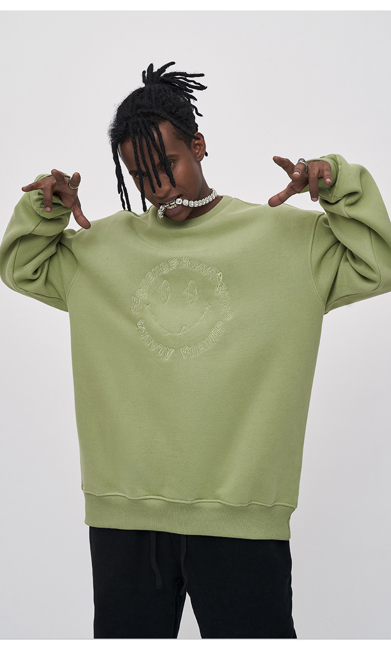 Embroidered smiley face sweatshirt
