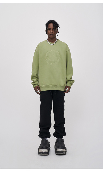 Embroidered smiley face sweatshirt