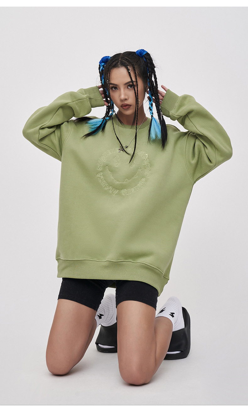 Embroidered smiley face sweatshirt
