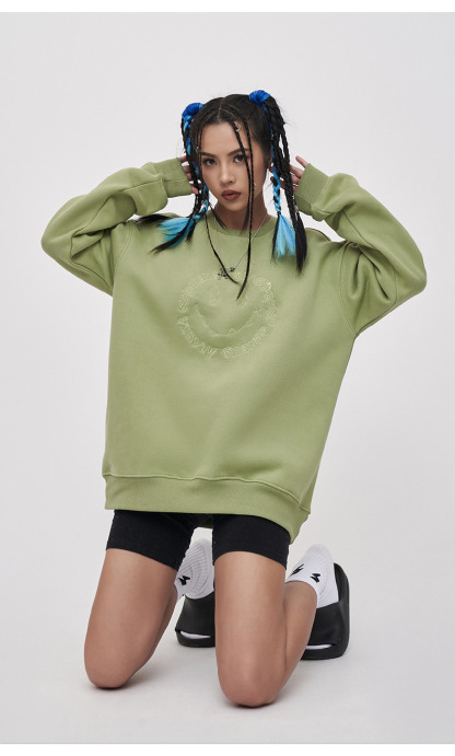 Embroidered smiley face sweatshirt