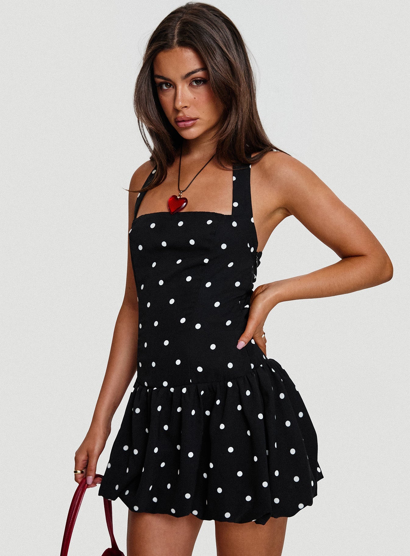 side view of model wearing Princess Polly Gigli Bubble Hem Mini Dress Polka Dot Square Neck
