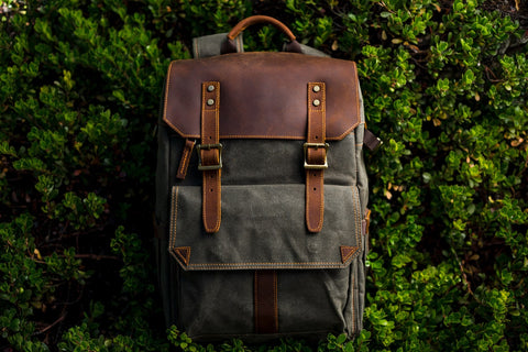 camera backpack for mirroless camera and digital slr with a protective leather flap
