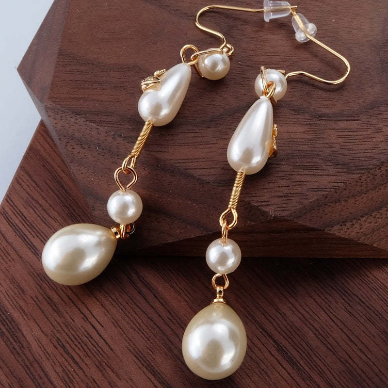Buy replica Vivienne Westwood Teardrop Pearl Saturn Earrings and replica jewelry from PICKS Jewelry