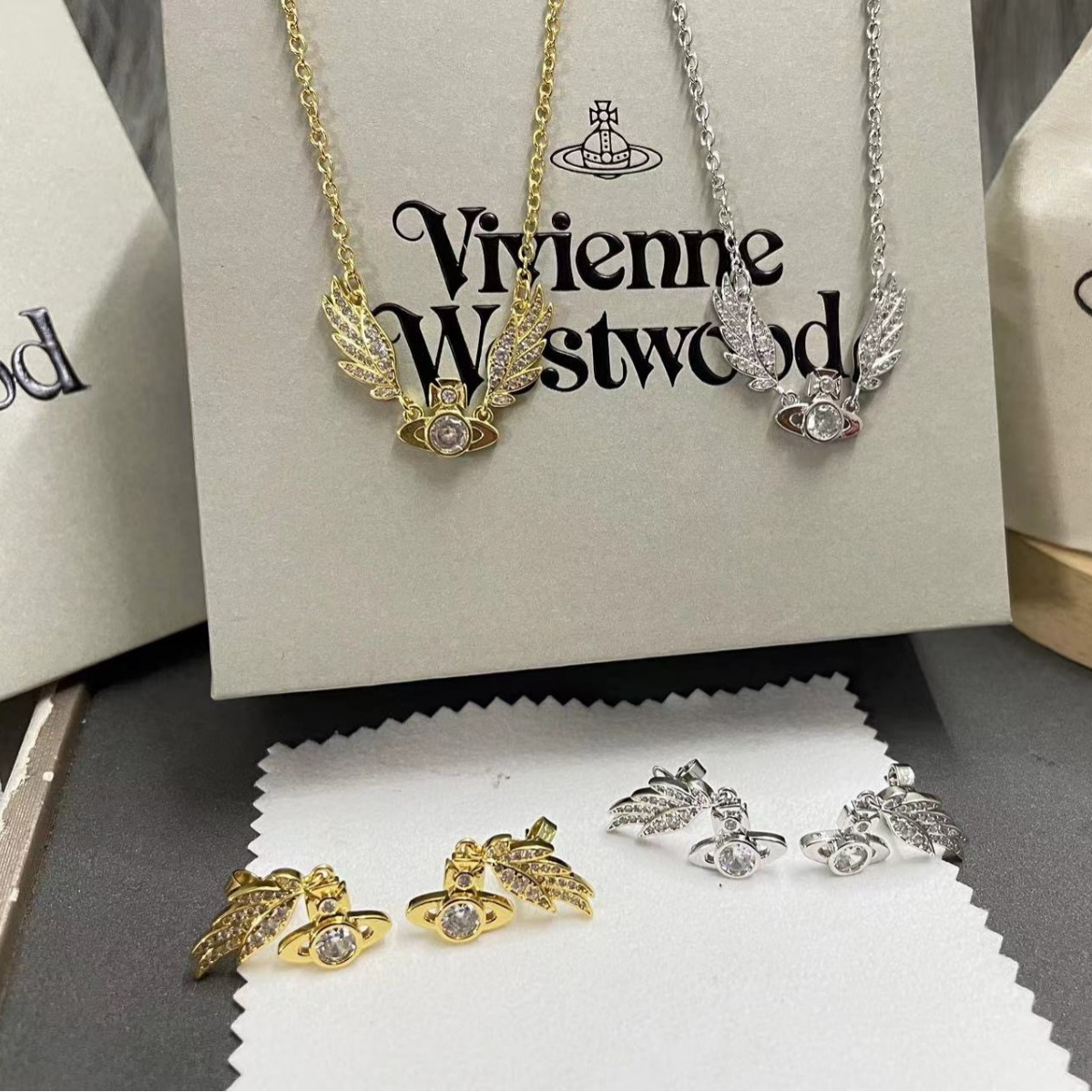 Buy replica Vivienne Westwood Angel Wing Saturn Earrings and replica jewelry from PICKS Jewelry